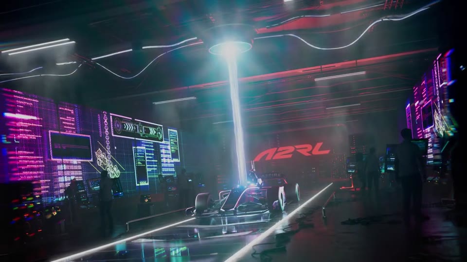 A2RL autonomous race car in a neon control room