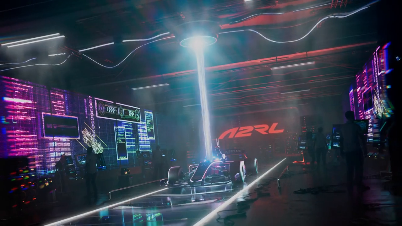 A2RL autonomous race car in a neon-lit control room