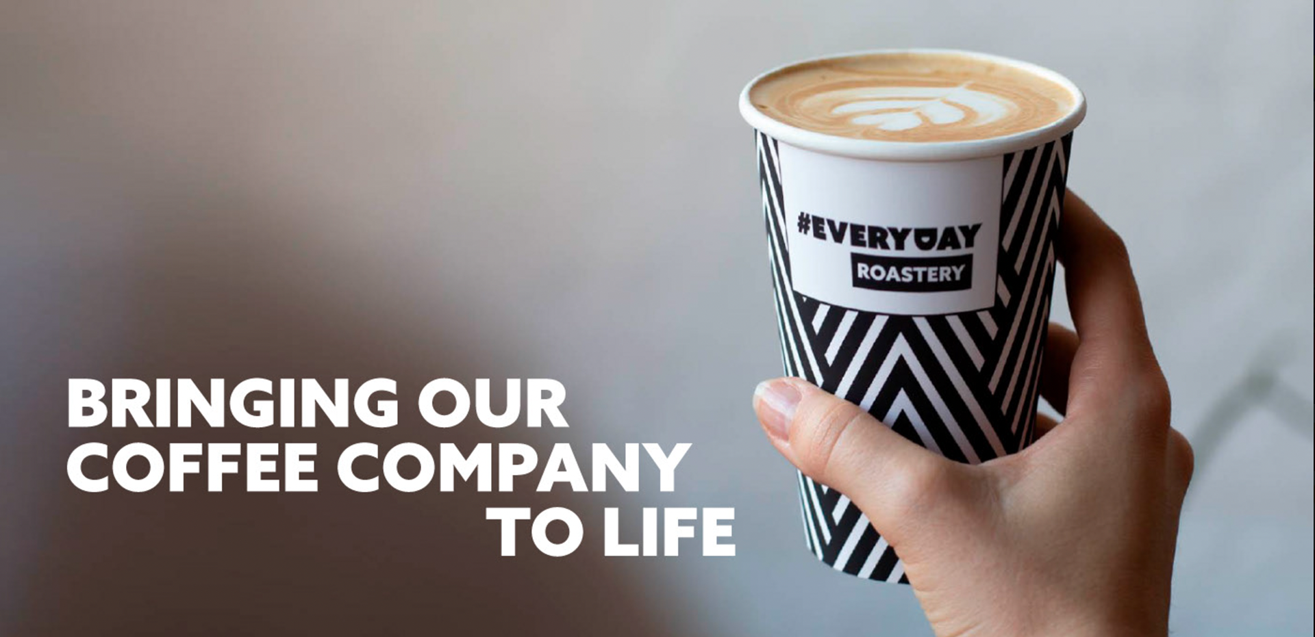 Everyday Roastery campaign artwork with a branded coffee cup and the line Bringing our coffee company to life