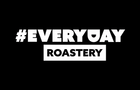 White Everyday Roastery logo on a black background