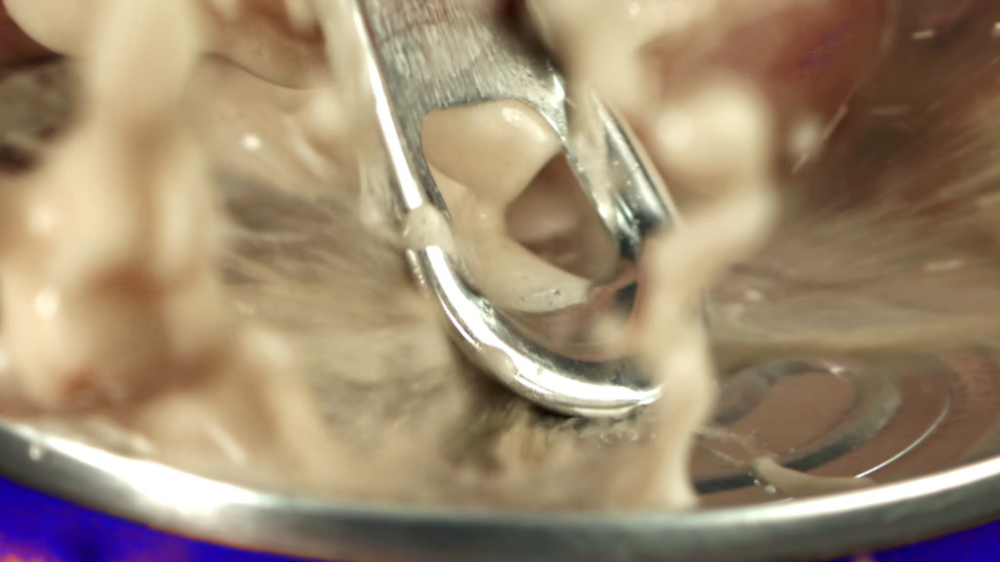 Macro close-up of liquid and metallic product detail