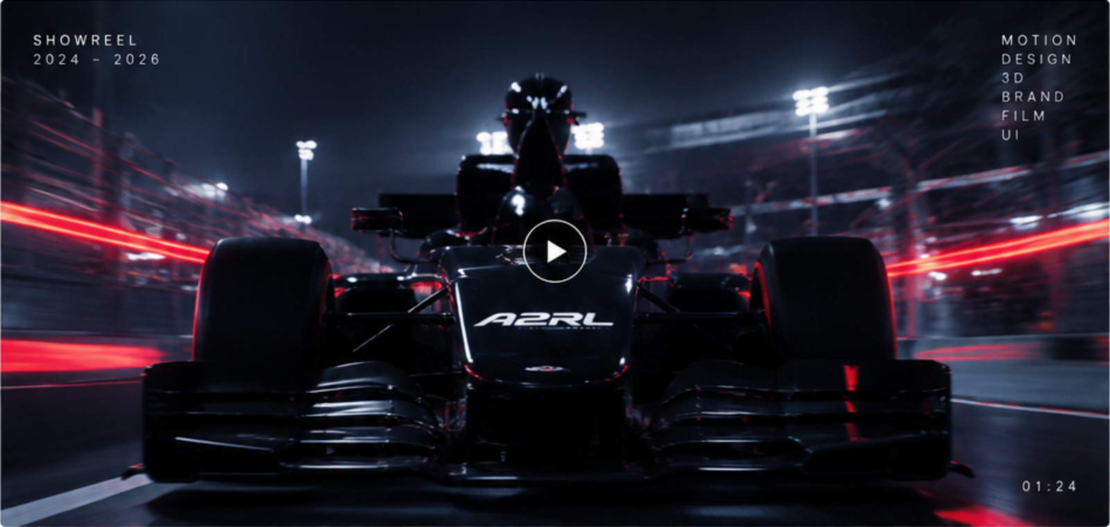 A2RL race car on a floodlit track with red light trails